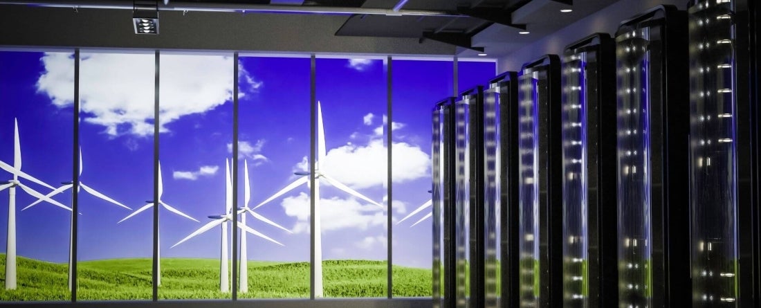image of wind farm outside of an indoor data center